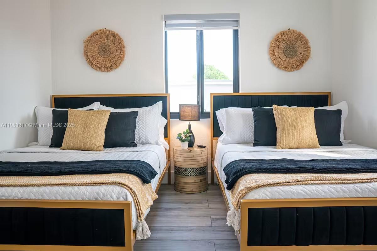 271 Northwest 143rd Street Miami, FL 33168 - Photo 23 of 43 a bedroom with bed and a window