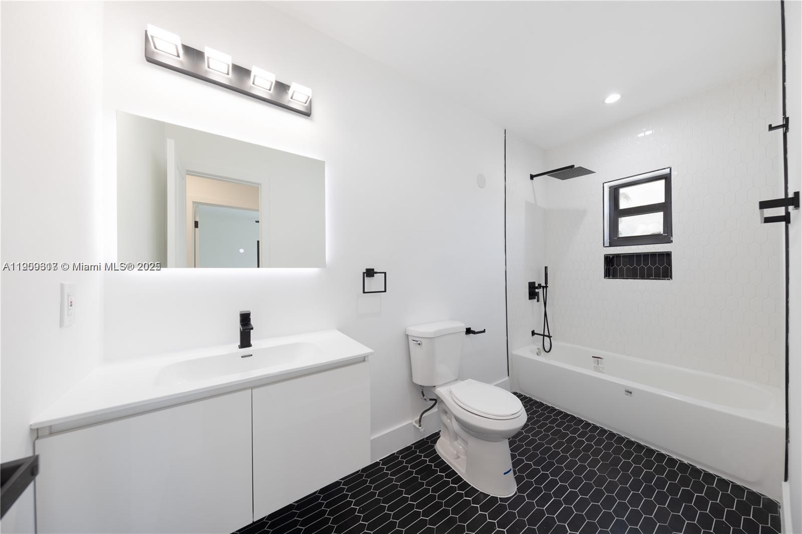 271 Northwest 143rd Street Miami, FL 33168 - Photo 24 of 43 a bathroom with a sink toilet and shower