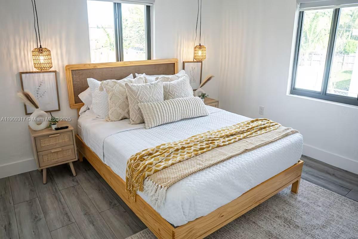 271 Northwest 143rd Street Miami, FL 33168 - Photo 28 of 43 a bedroom with a bed and window