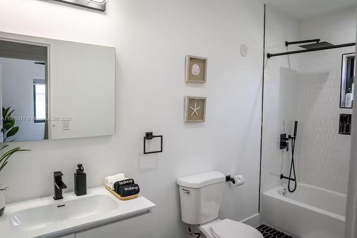 271 Northwest 143rd Street Miami, FL 33168 - Photo 30 of 43 a bathroom with a sink toilet and shower