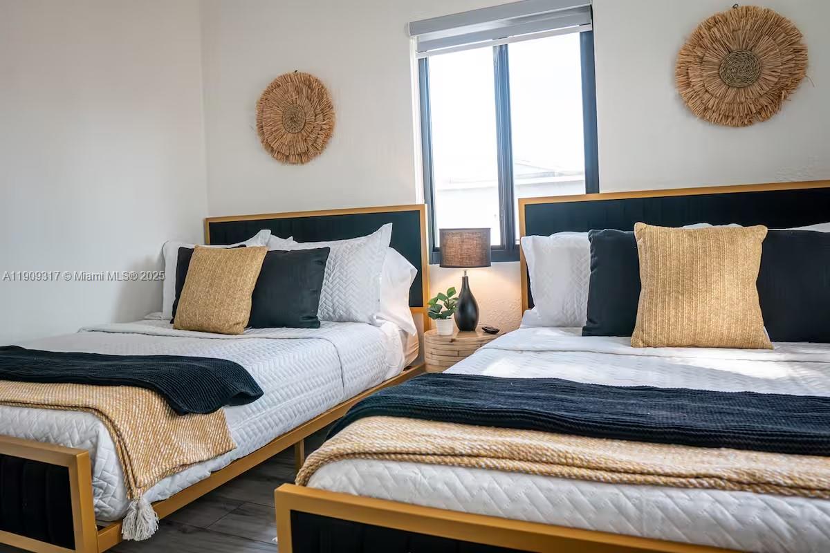 271 Northwest 143rd Street Miami, FL 33168 - Photo 31 of 43 a bedroom with bed and a window