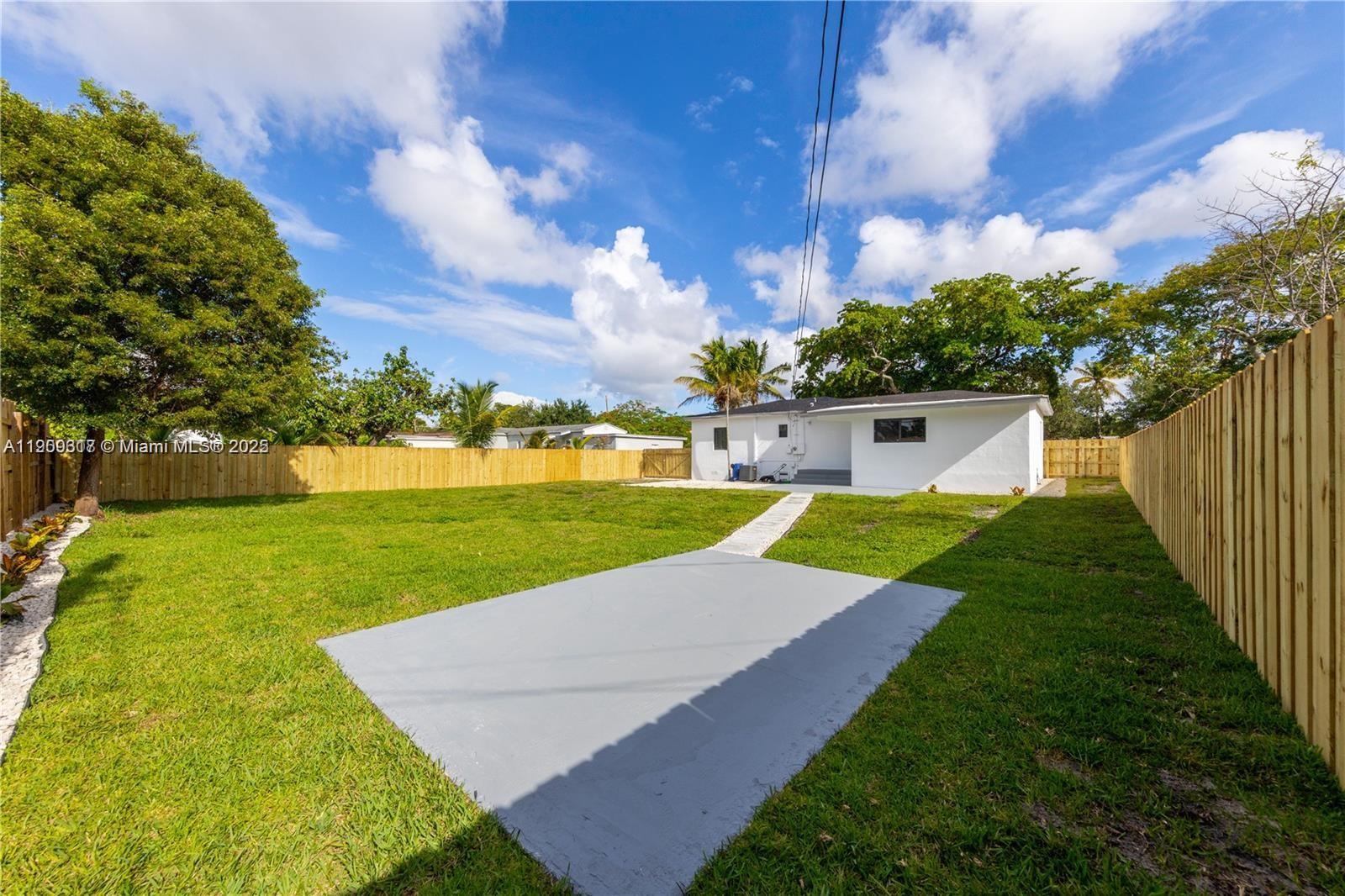 271 Northwest 143rd Street Miami, FL 33168 - Photo 39 of 43 a view of a house with a big yard