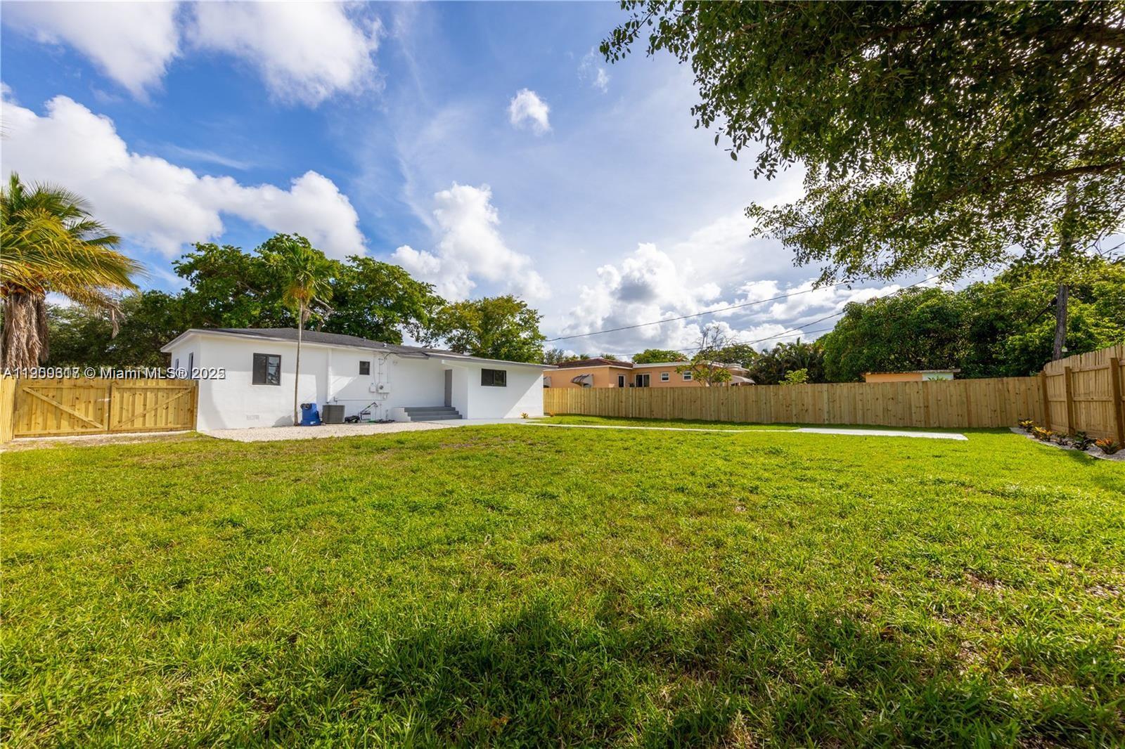 271 Northwest 143rd Street Miami, FL 33168 - Photo 40 of 43 a house view with swimming pool and garden