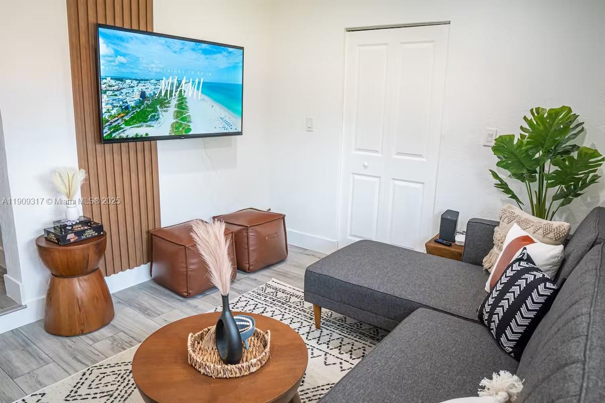 271 Northwest 143rd Street Miami, FL 33168 - Photo 4 of 43 a living room with furniture and a potted plant