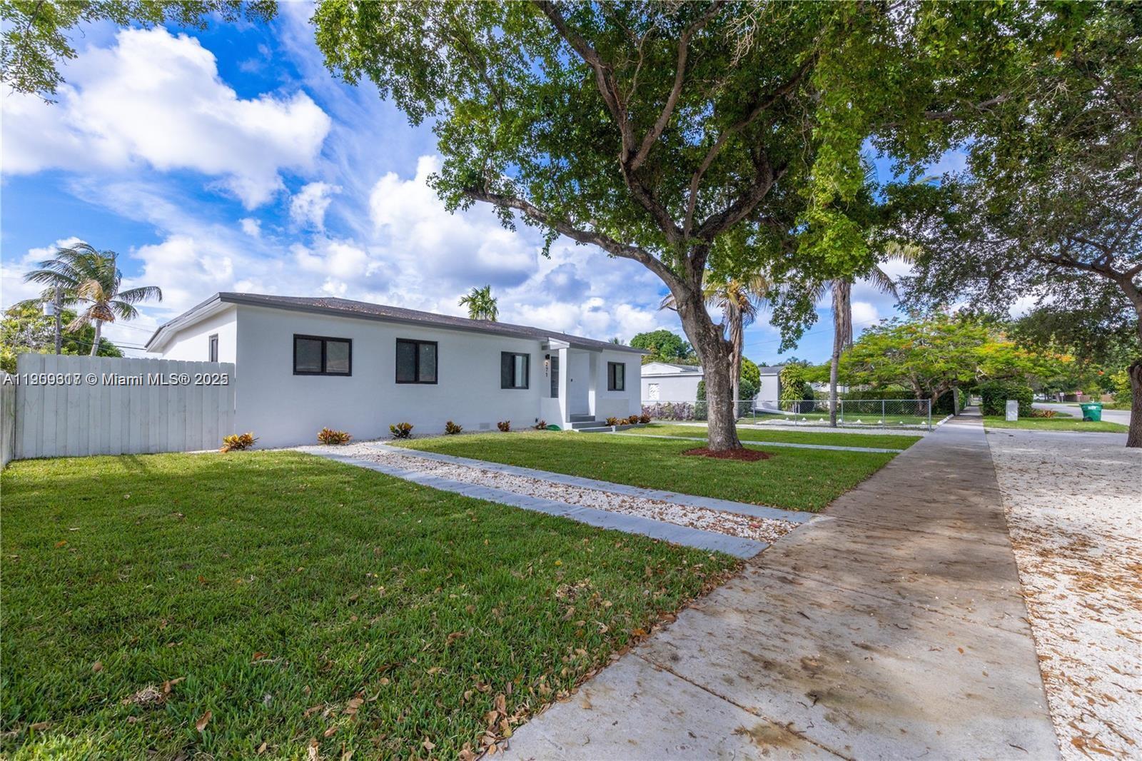 271 Northwest 143rd Street Miami, FL 33168 - Photo 41 of 43 a view of a house with a big yard