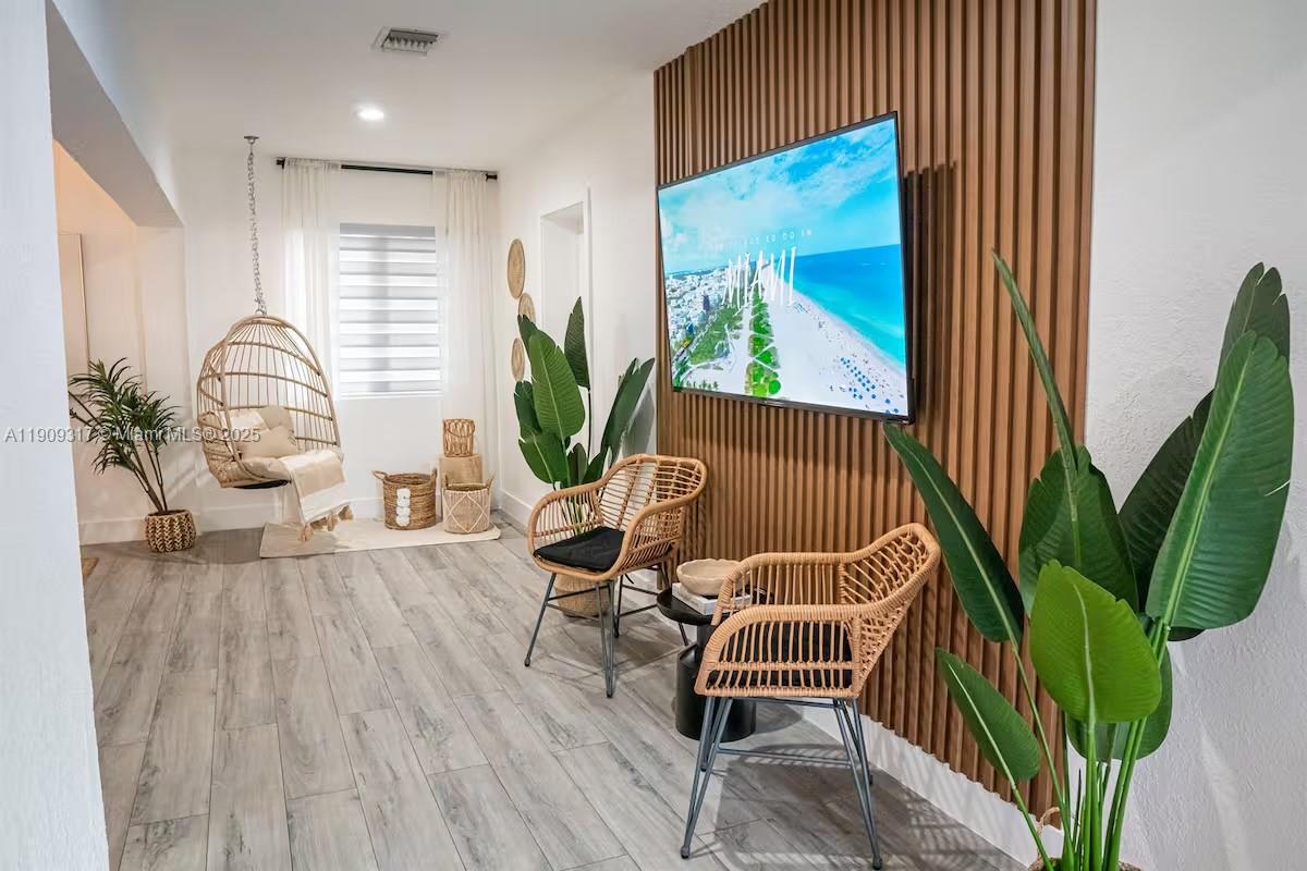 271 Northwest 143rd Street Miami, FL 33168 - Photo 5 of 43 a living room with furniture and a wooden floor