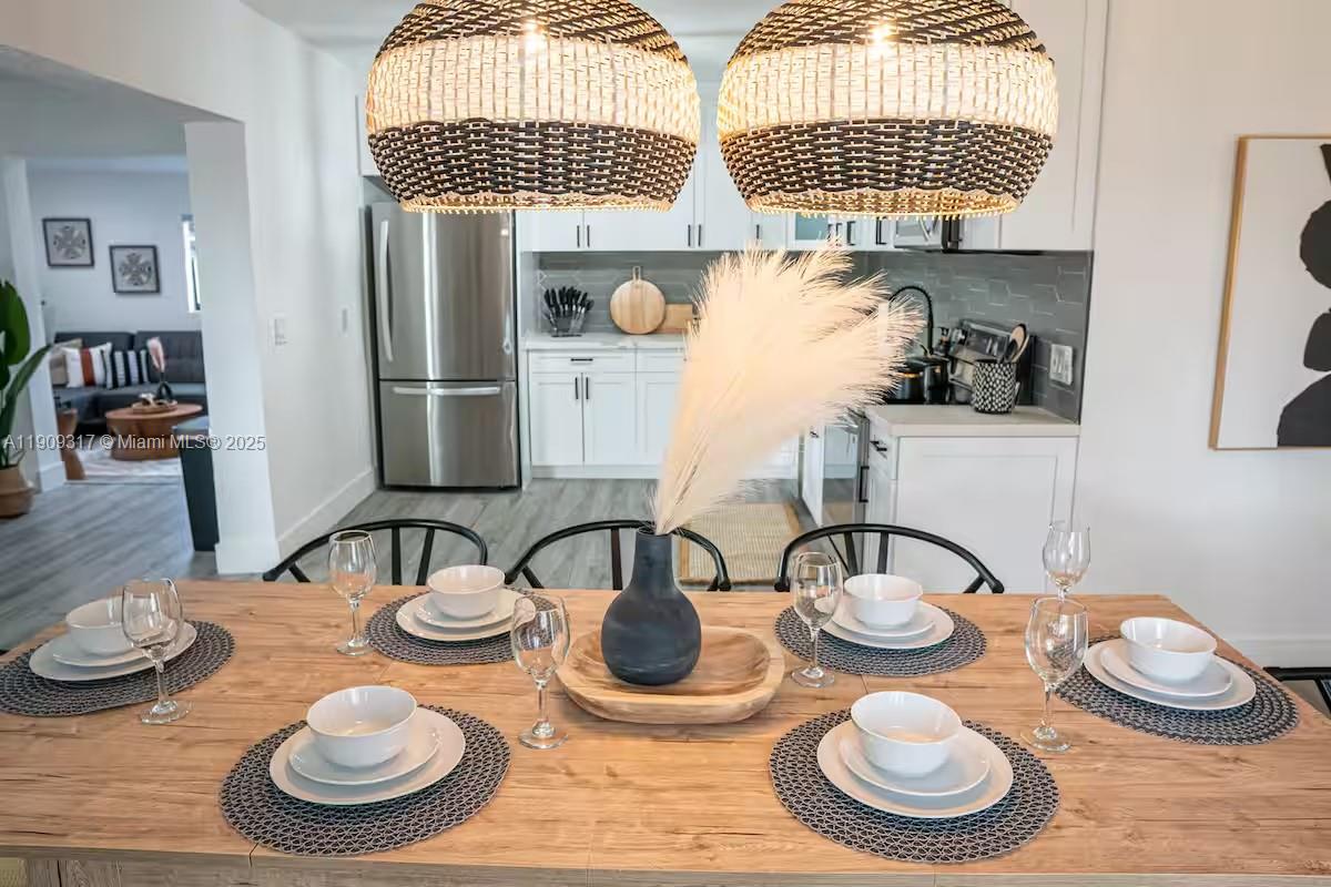 271 Northwest 143rd Street Miami, FL 33168 - Photo 10 of 43 a table and dining room with furniture