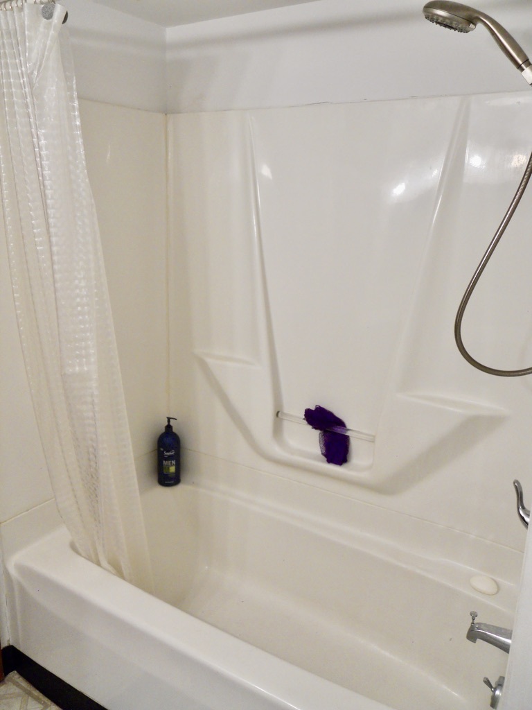 108 Kenneth Circle Elgin, IL 60120 - Photo 25 of 28 a bathroom with a tub and a shower