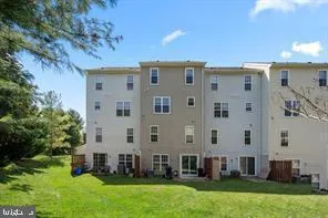 a view of house with yard