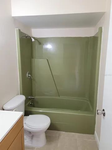 a bathroom with a sink a toilet and a bathtub