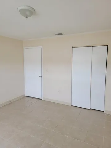 a bathroom with a sink a mirror and vanity