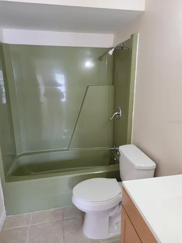 an aerial view of a house with outdoor space