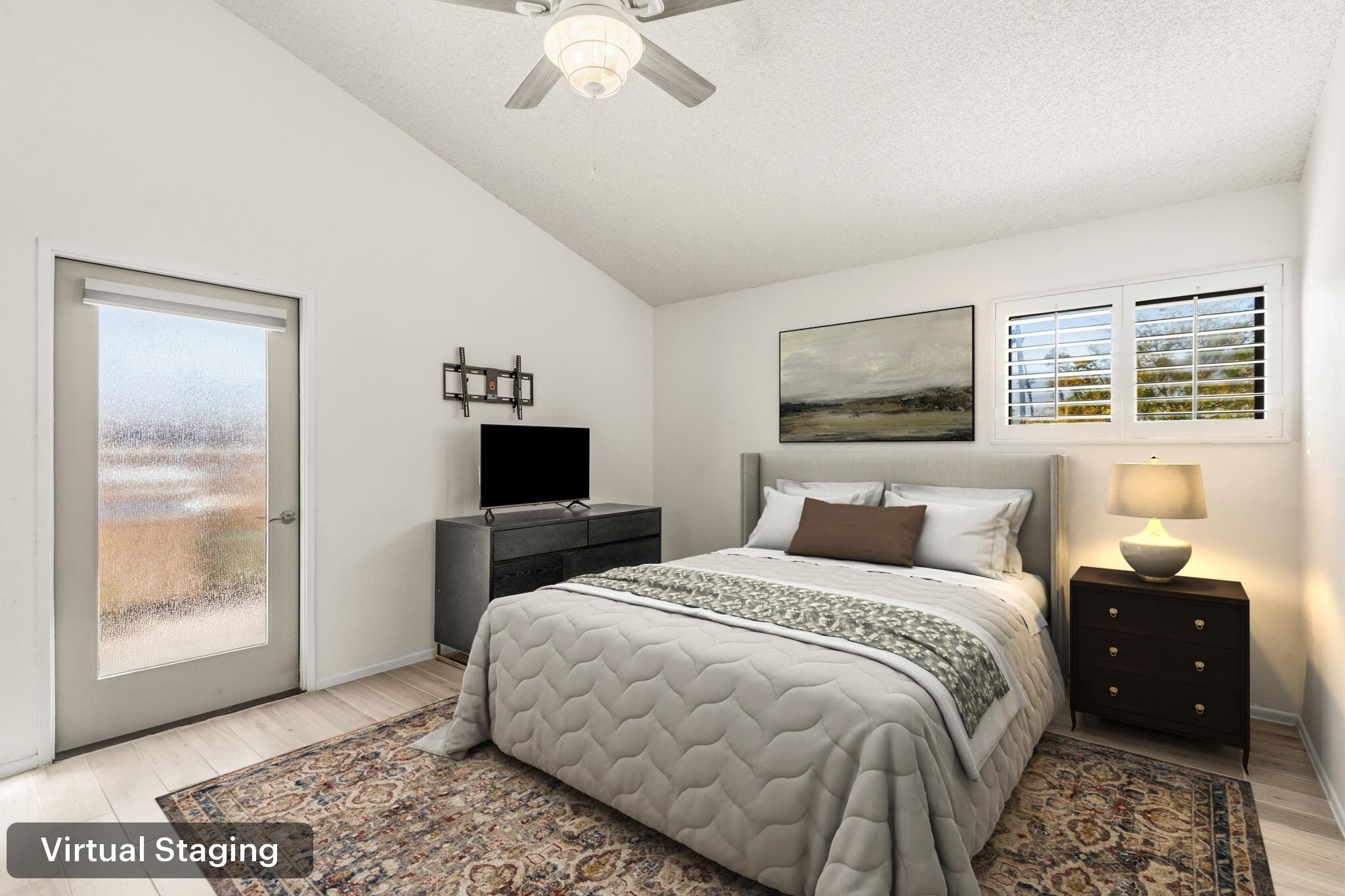 74171 Santa Rosa Circle Palm Desert, CA 92260 - Photo 12 of 32 a bedroom with a bed and wooden floor