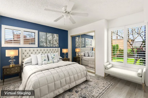 a spacious bedroom with a large bed and a couch