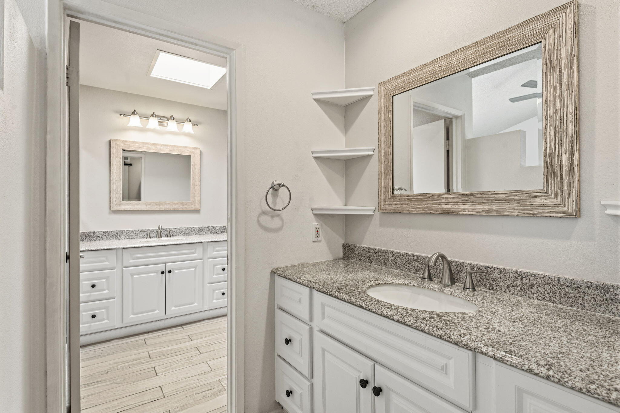 74171 Santa Rosa Circle Palm Desert, CA 92260 - Photo 16 of 32 a bathroom with a granite countertop sink vanity and mirror