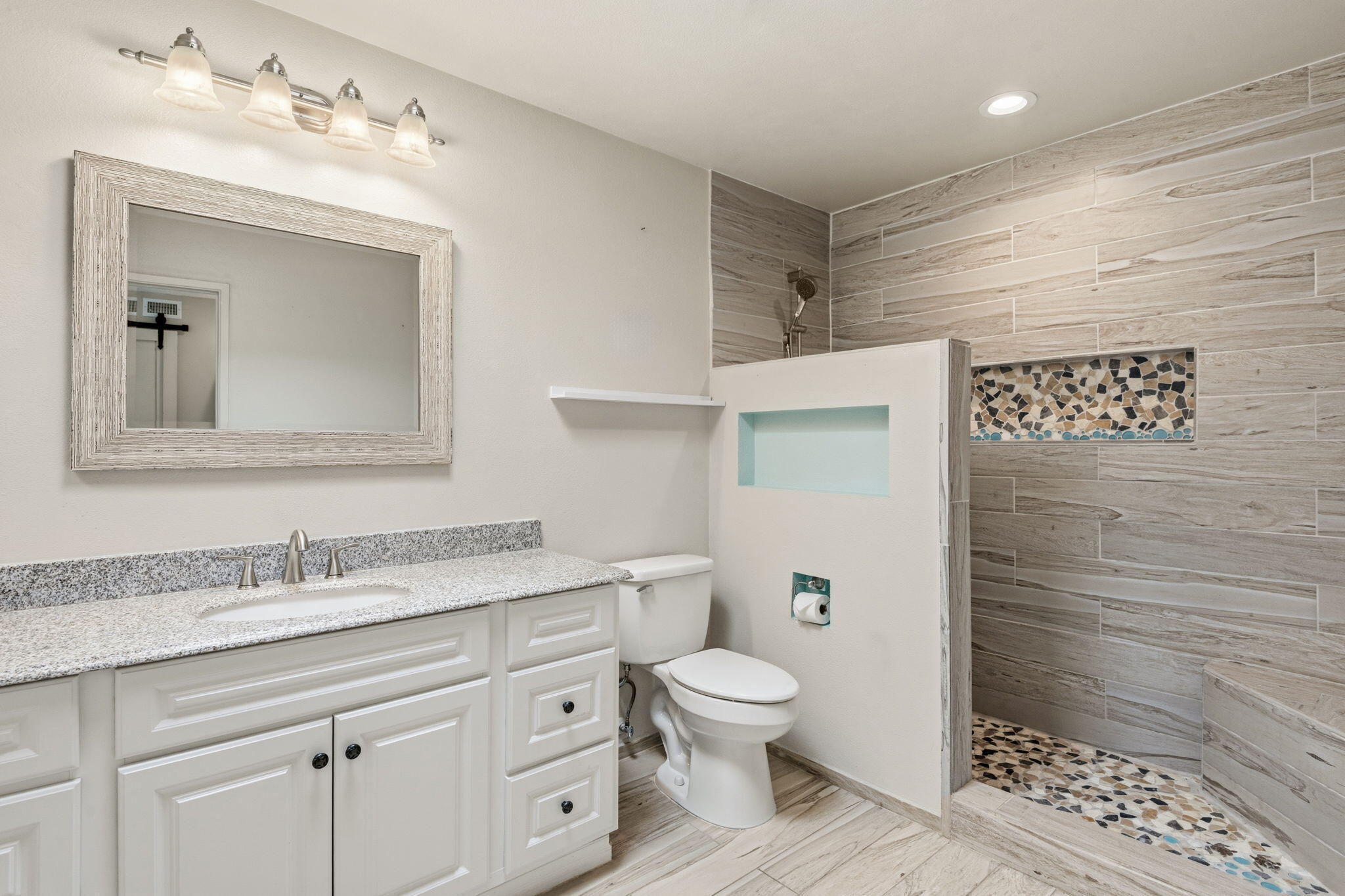 74171 Santa Rosa Circle Palm Desert, CA 92260 - Photo 17 of 32 a bathroom with a granite countertop toilet sink and mirror