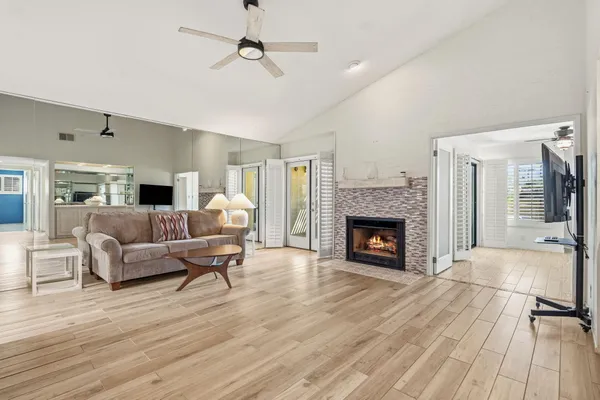 a living room with furniture and a fireplace