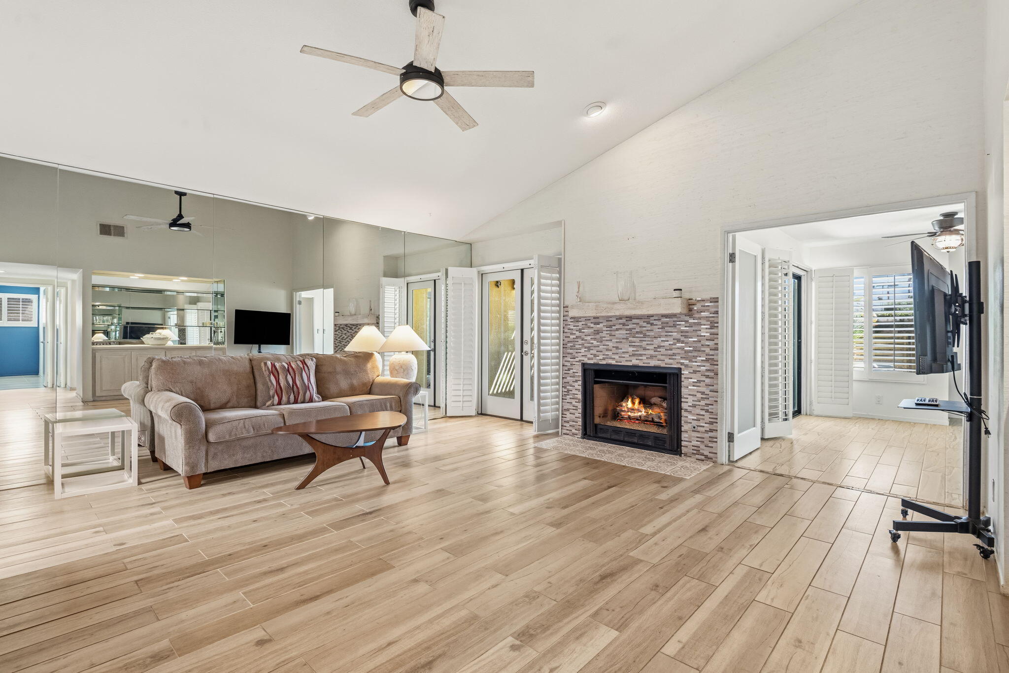 74171 Santa Rosa Circle Palm Desert, CA 92260 - Photo 4 of 32 a living room with furniture and a fireplace