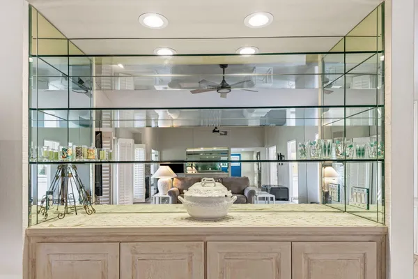 a bathroom with a mirror and a shower