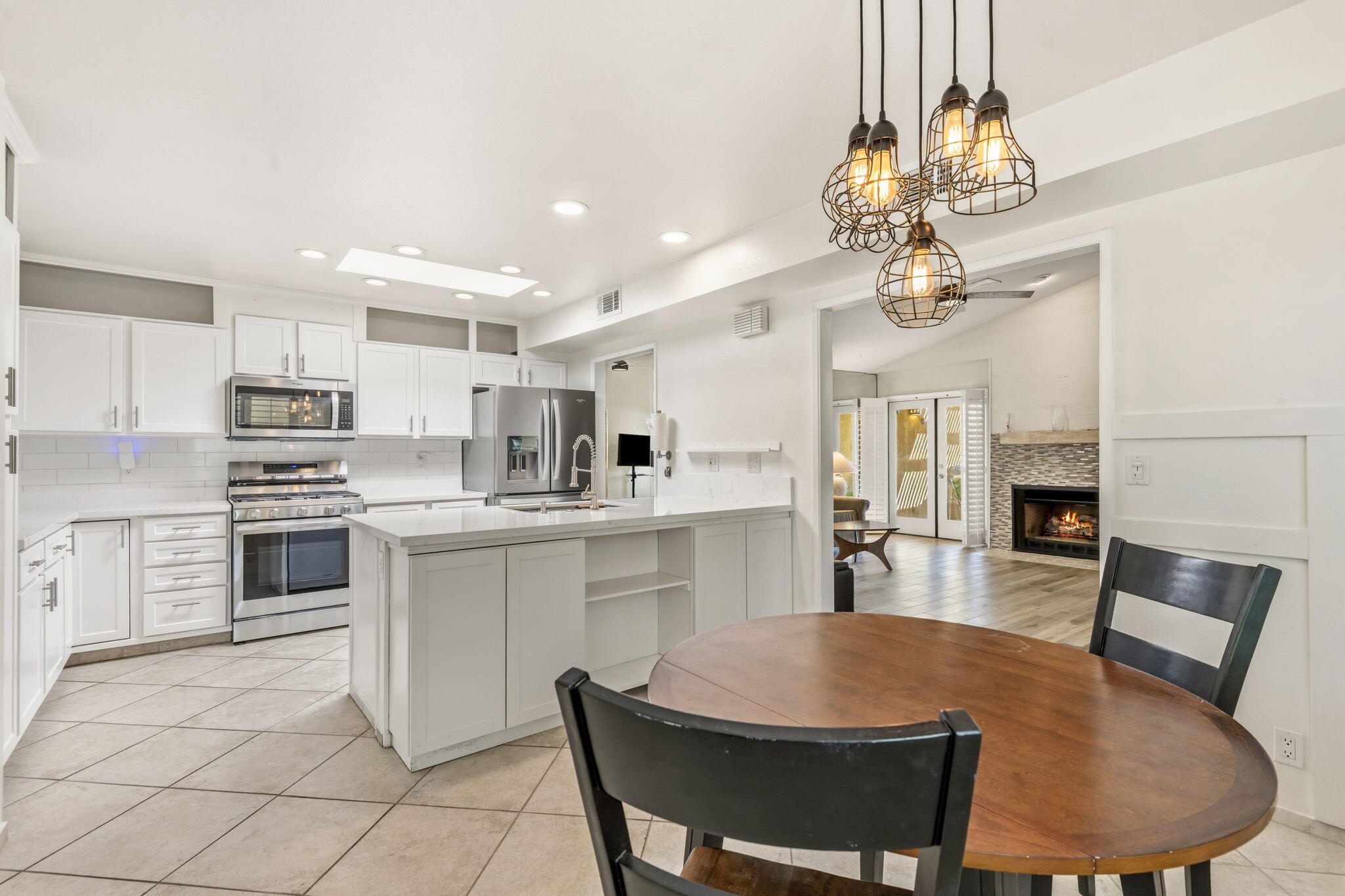 74171 Santa Rosa Circle Palm Desert, CA 92260 - Photo 7 of 32 a large kitchen with cabinets table and chairs
