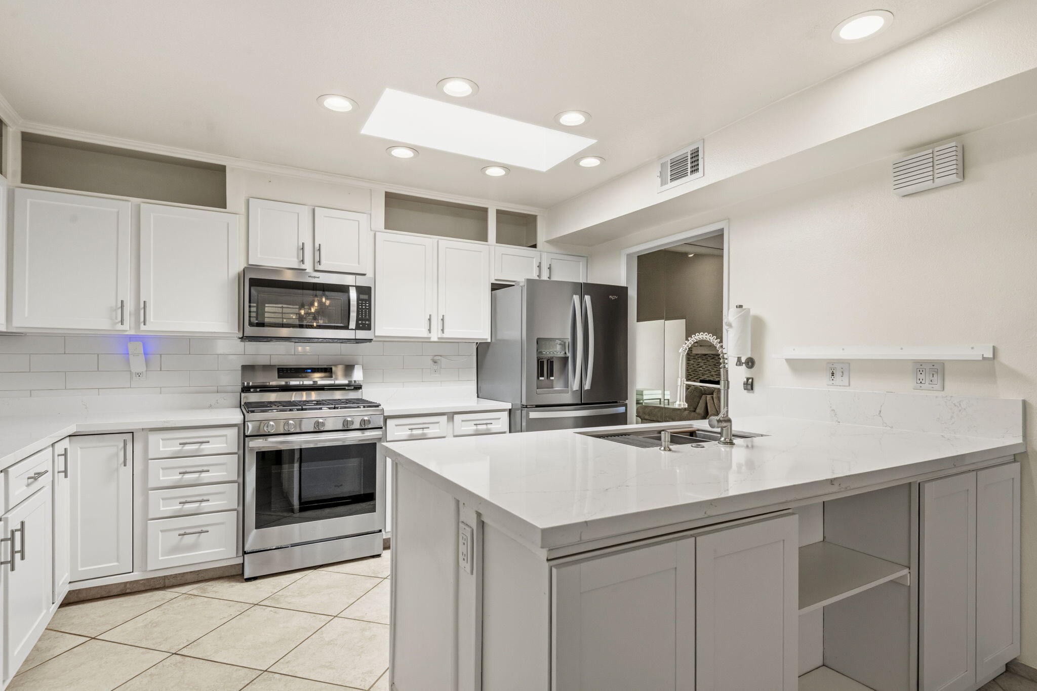 74171 Santa Rosa Circle Palm Desert, CA 92260 - Photo 8 of 32 a kitchen with appliances a sink cabinets and a counter top space