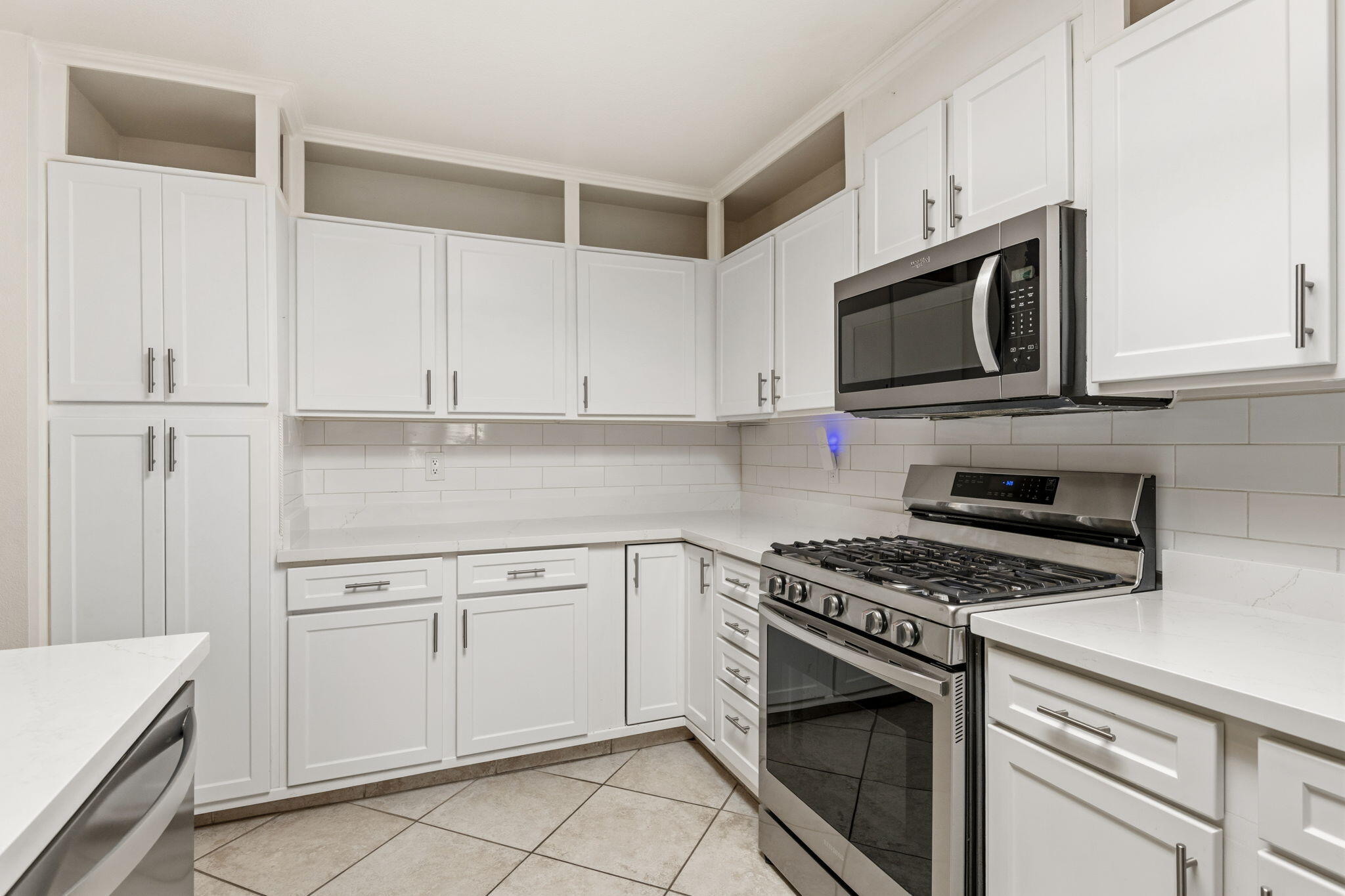 74171 Santa Rosa Circle Palm Desert, CA 92260 - Photo 9 of 32 a kitchen with cabinets stainless steel appliances and a sink