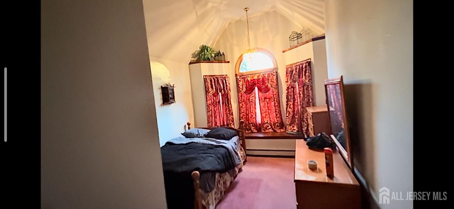 114 Greenwood Road Morganville, NJ 07751 - Photo 4 of 7 a view of walk in closet with clothes and shoes