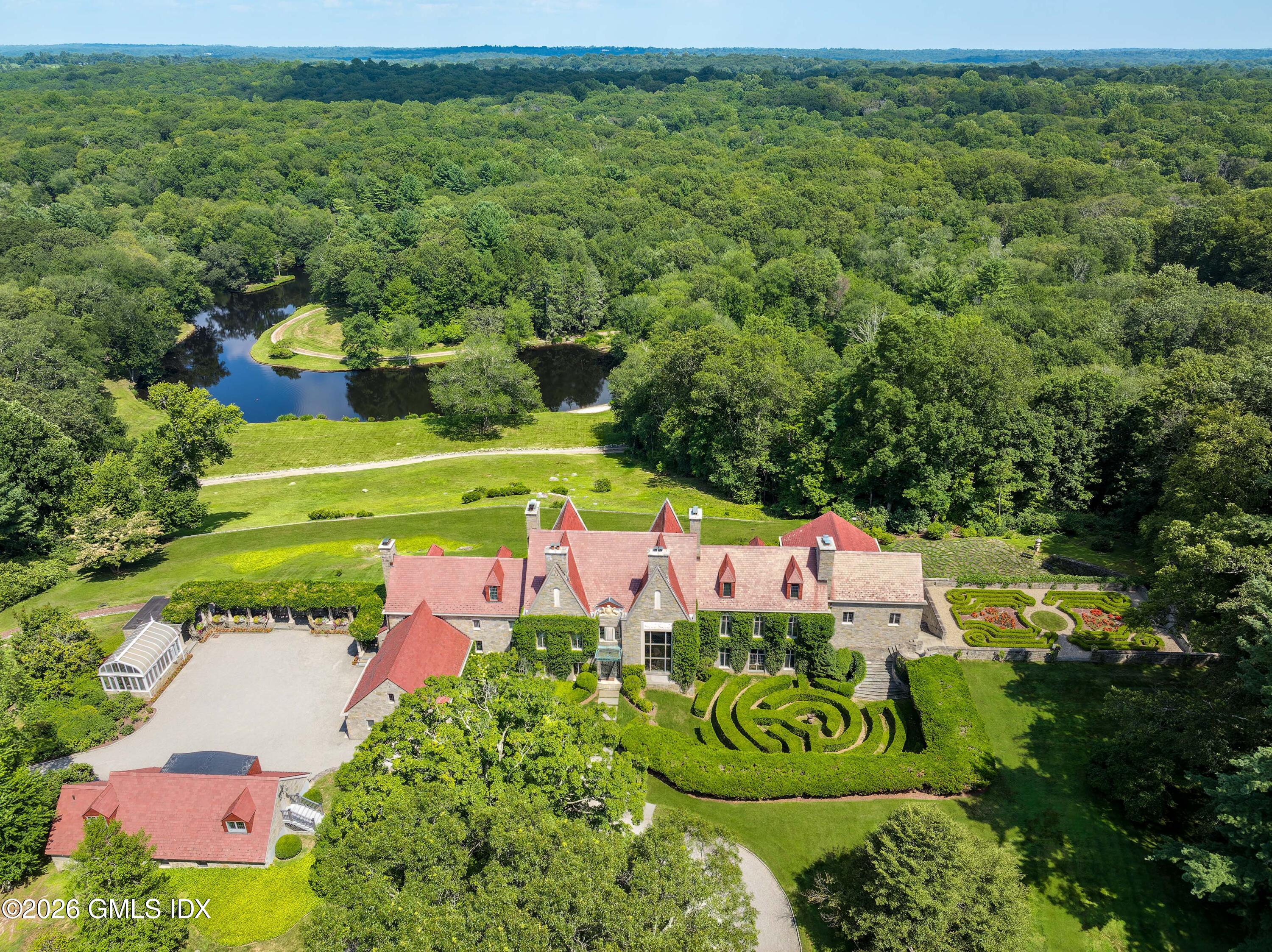 1233 Rock Rimmon Road Stamford, CT 06903 - Photo 1 of 50 a view of a swimming pool with a yard and plants