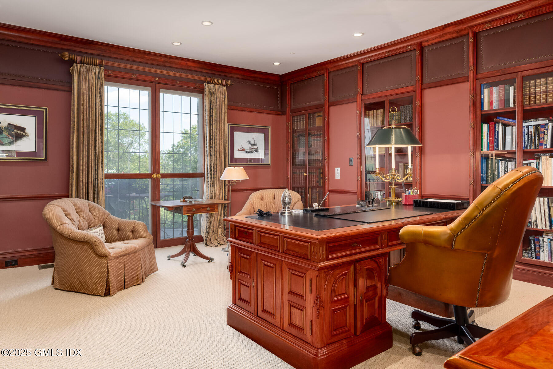 1233 Rock Rimmon Road Stamford, CT 06903 - Photo 19 of 50 a living room with furniture a bookshelf and a large window