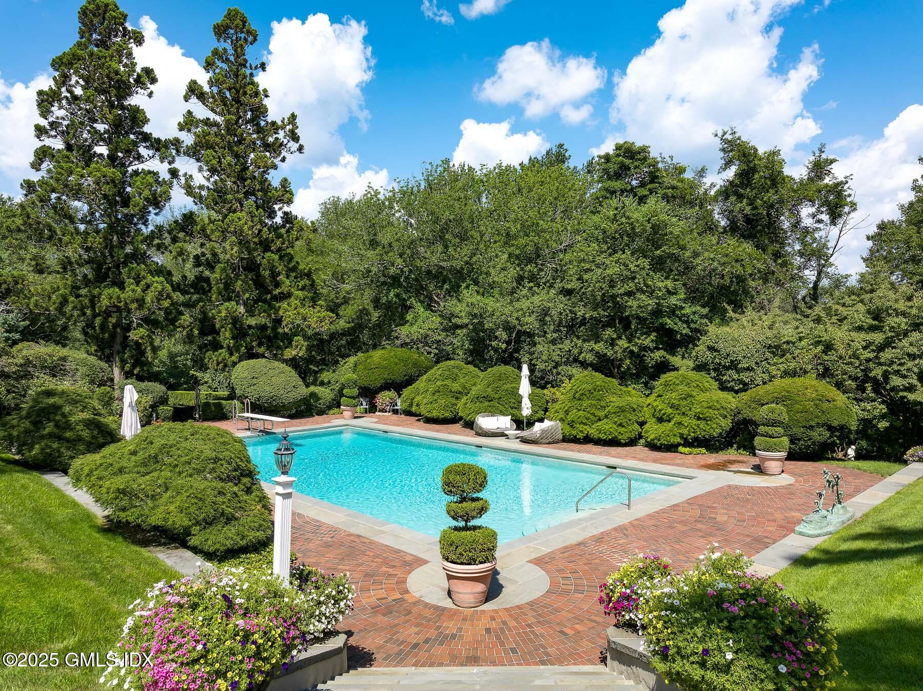 1233 Rock Rimmon Road Stamford, CT 06903 - Photo 30 of 50 a view of a garden with lawn chairs