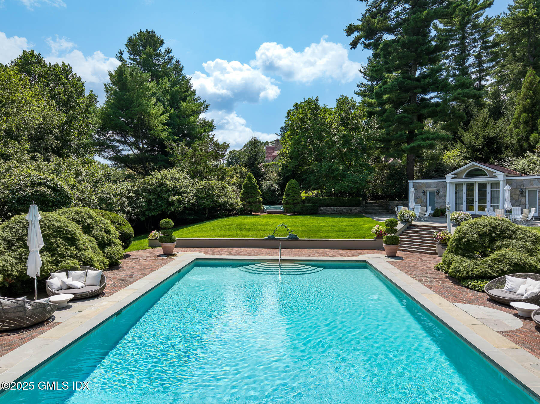 1233 Rock Rimmon Road Stamford, CT 06903 - Photo 31 of 50 a view of a house with swimming pool and yard
