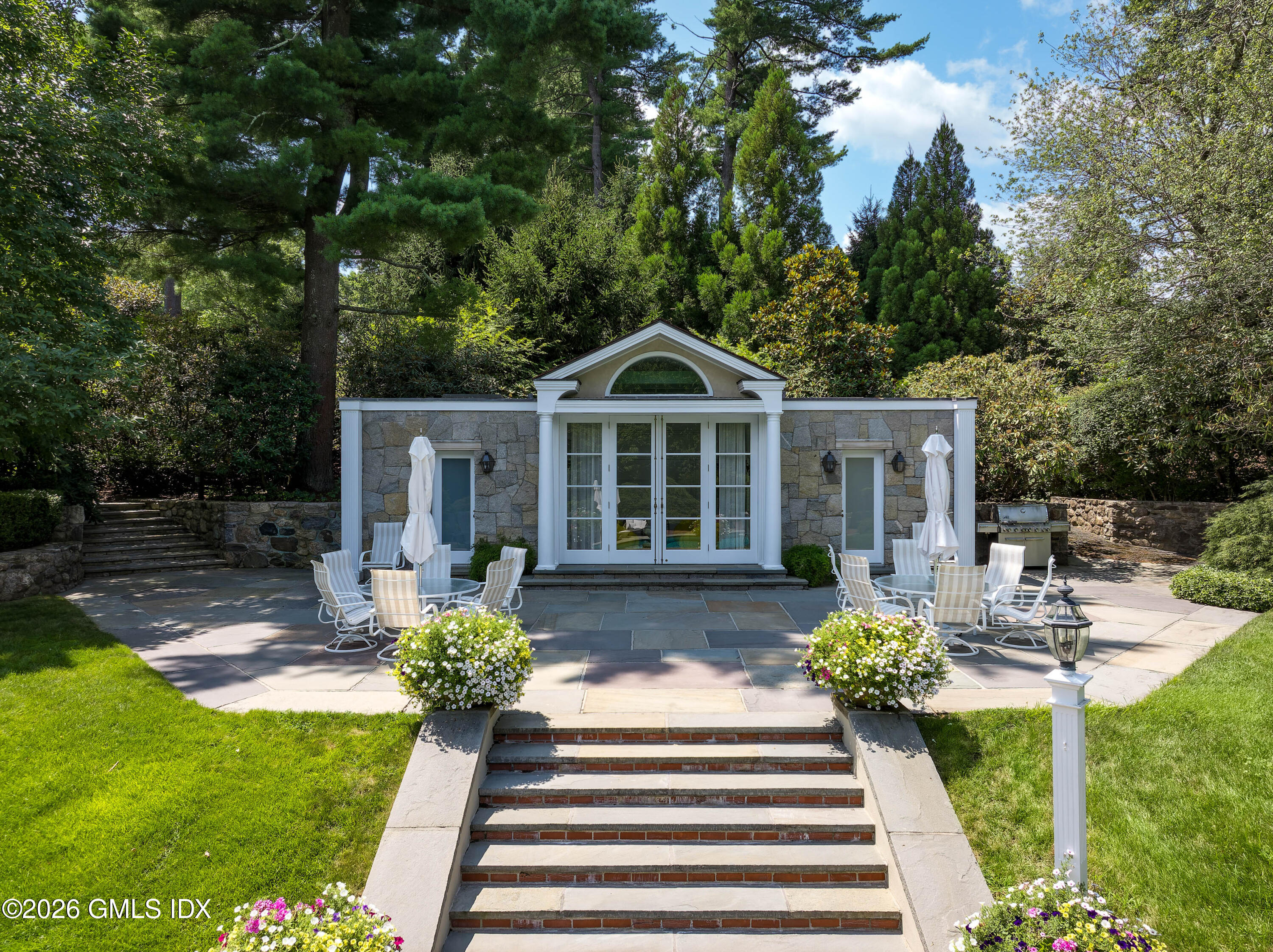 1233 Rock Rimmon Road Stamford, CT 06903 - Photo 32 of 50 a front view of a house with garden