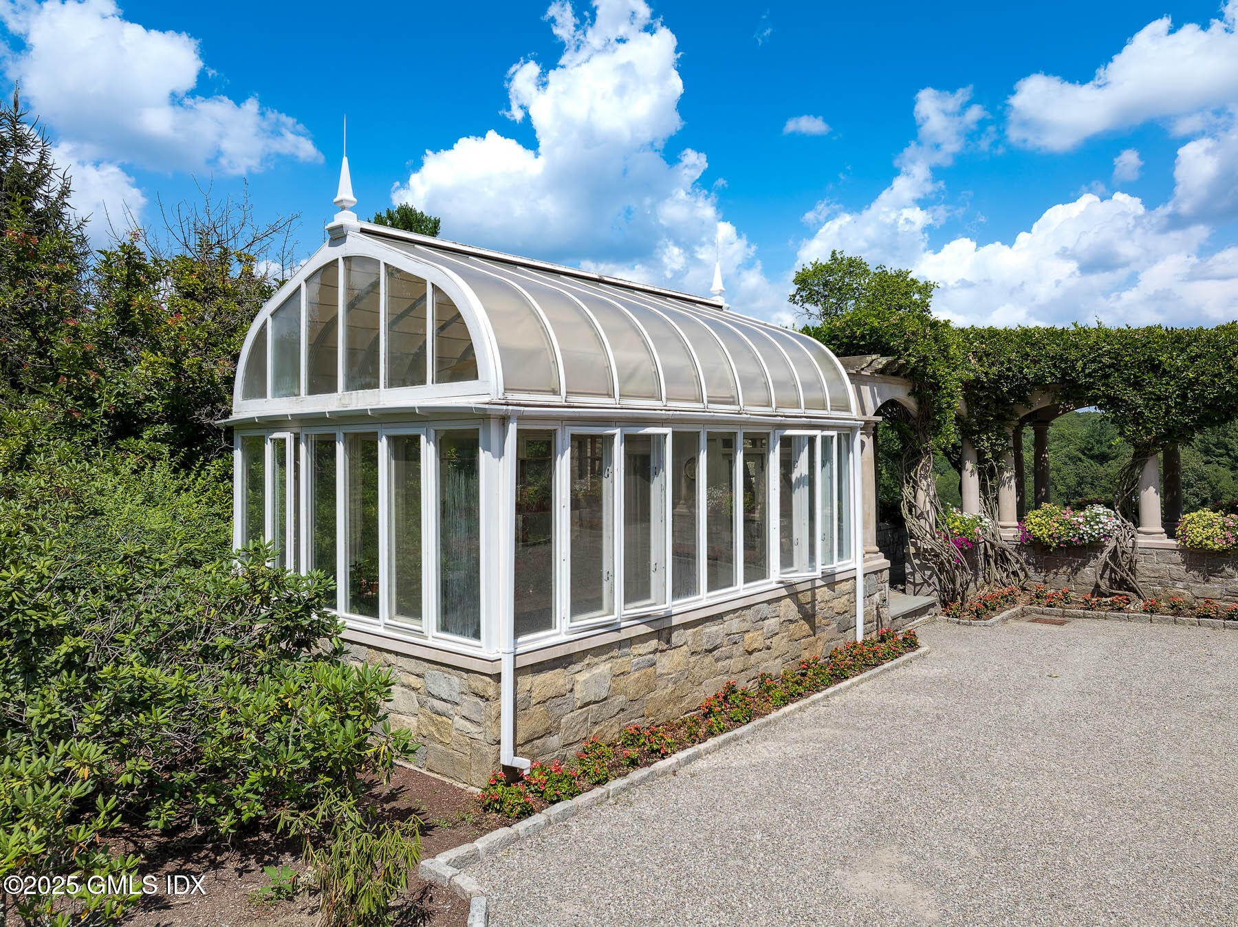 1233 Rock Rimmon Road Stamford, CT 06903 - Photo 35 of 50 a view of a house with backyard and sitting area