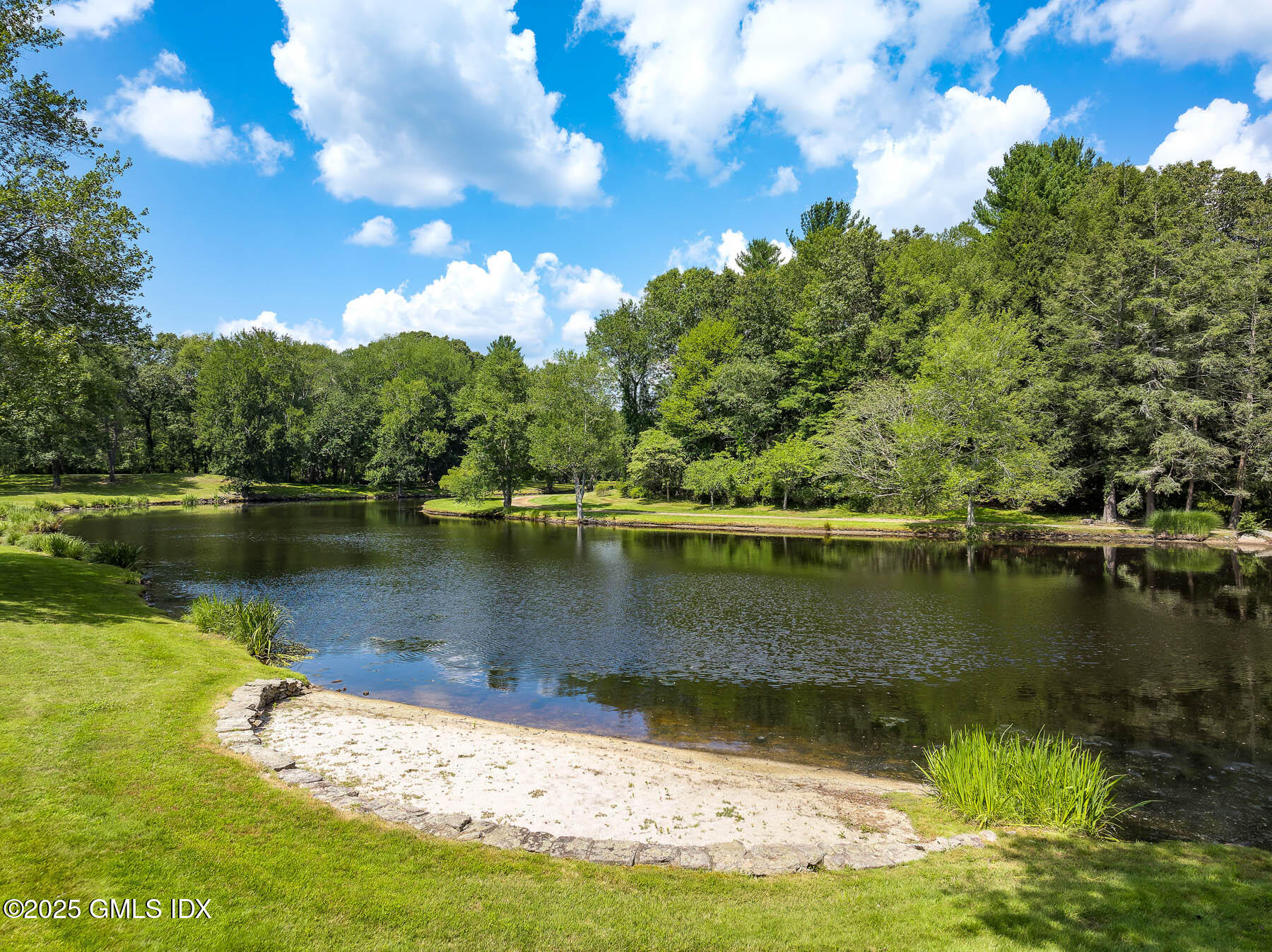 1233 Rock Rimmon Road Stamford, CT 06903 - Photo 39 of 50 a view of a lake with a yard