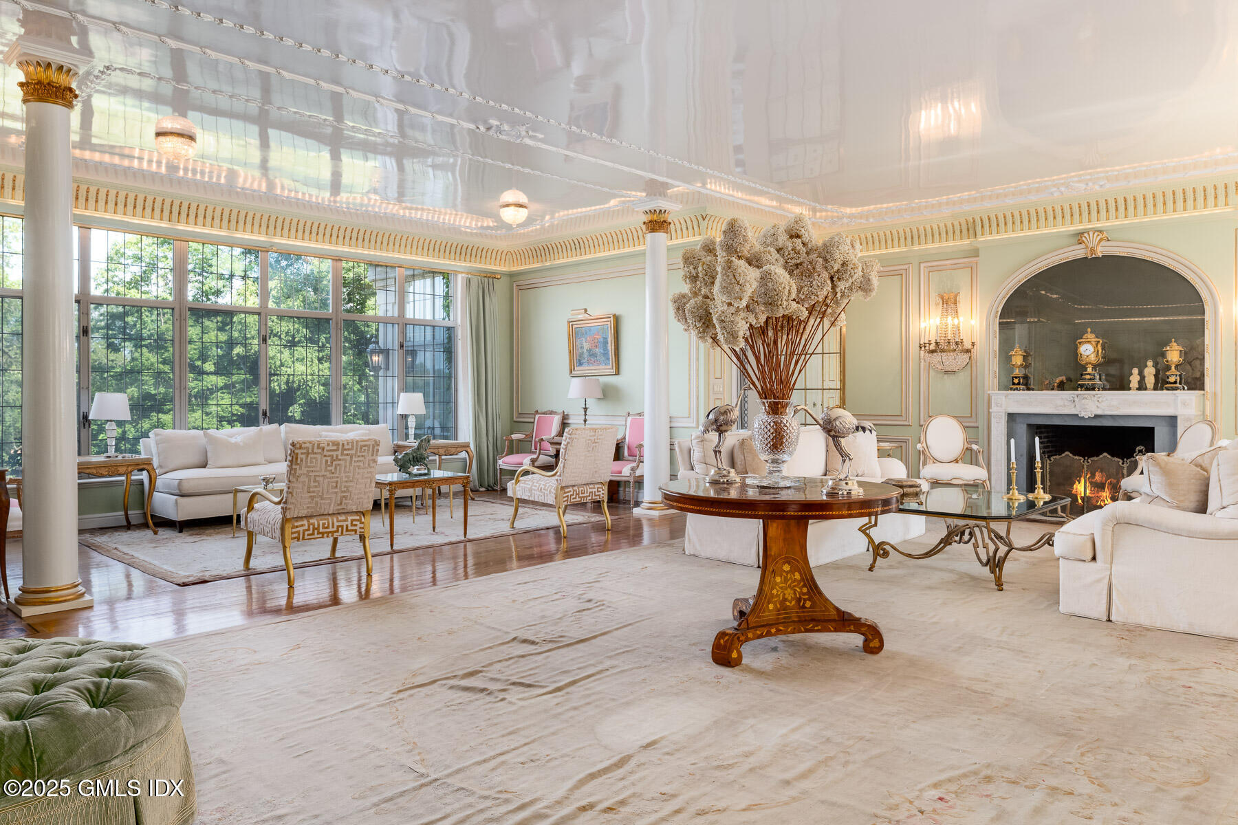 1233 Rock Rimmon Road Stamford, CT 06903 - Photo 4 of 50 a living room with furniture a chandelier and a large window