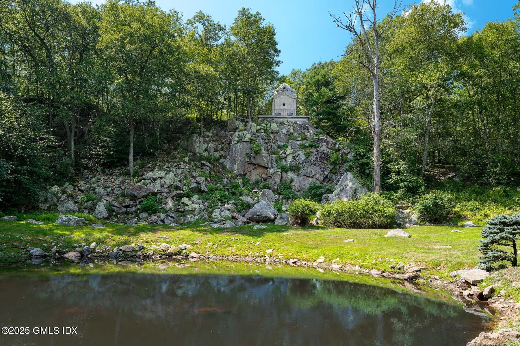 1233 Rock Rimmon Road Stamford, CT 06903 - Photo 42 of 50 a view of a lake with a yard