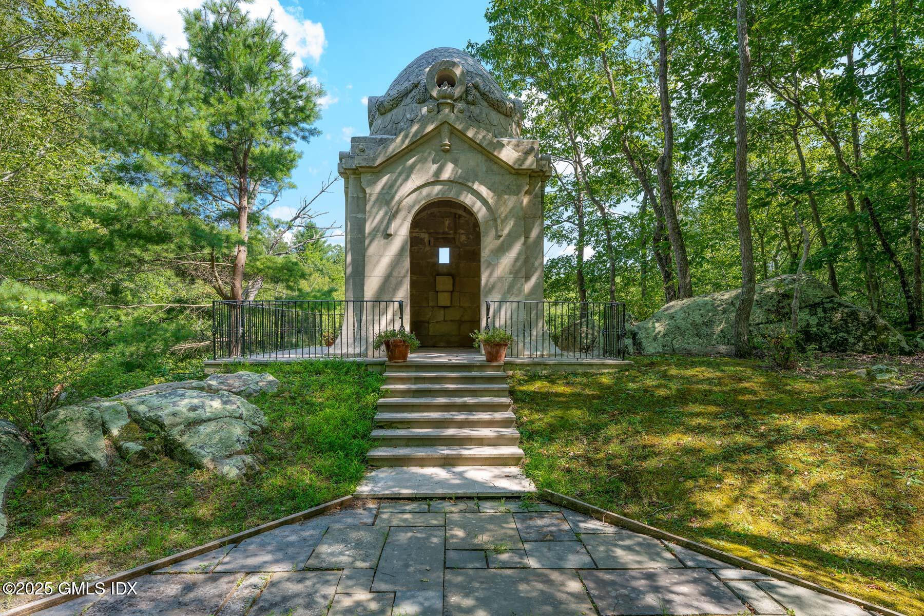 1233 Rock Rimmon Road Stamford, CT 06903 - Photo 44 of 50 a front view of a house with garden