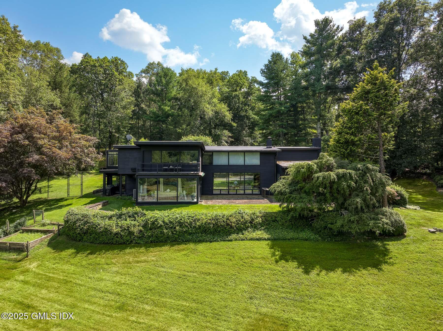 1233 Rock Rimmon Road Stamford, CT 06903 - Photo 47 of 50 a view of house in middle of green space