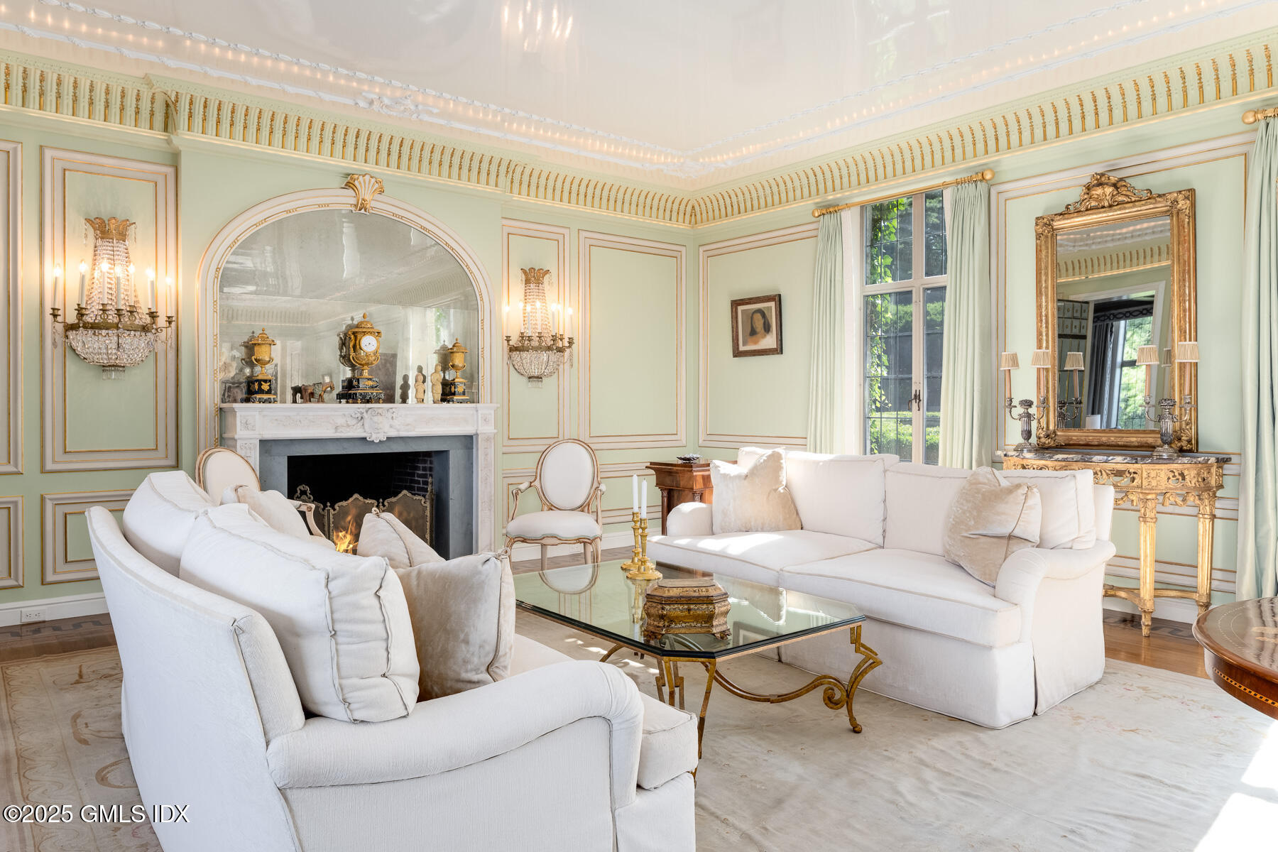 1233 Rock Rimmon Road Stamford, CT 06903 - Photo 5 of 50 a living room with a fireplace and a large window