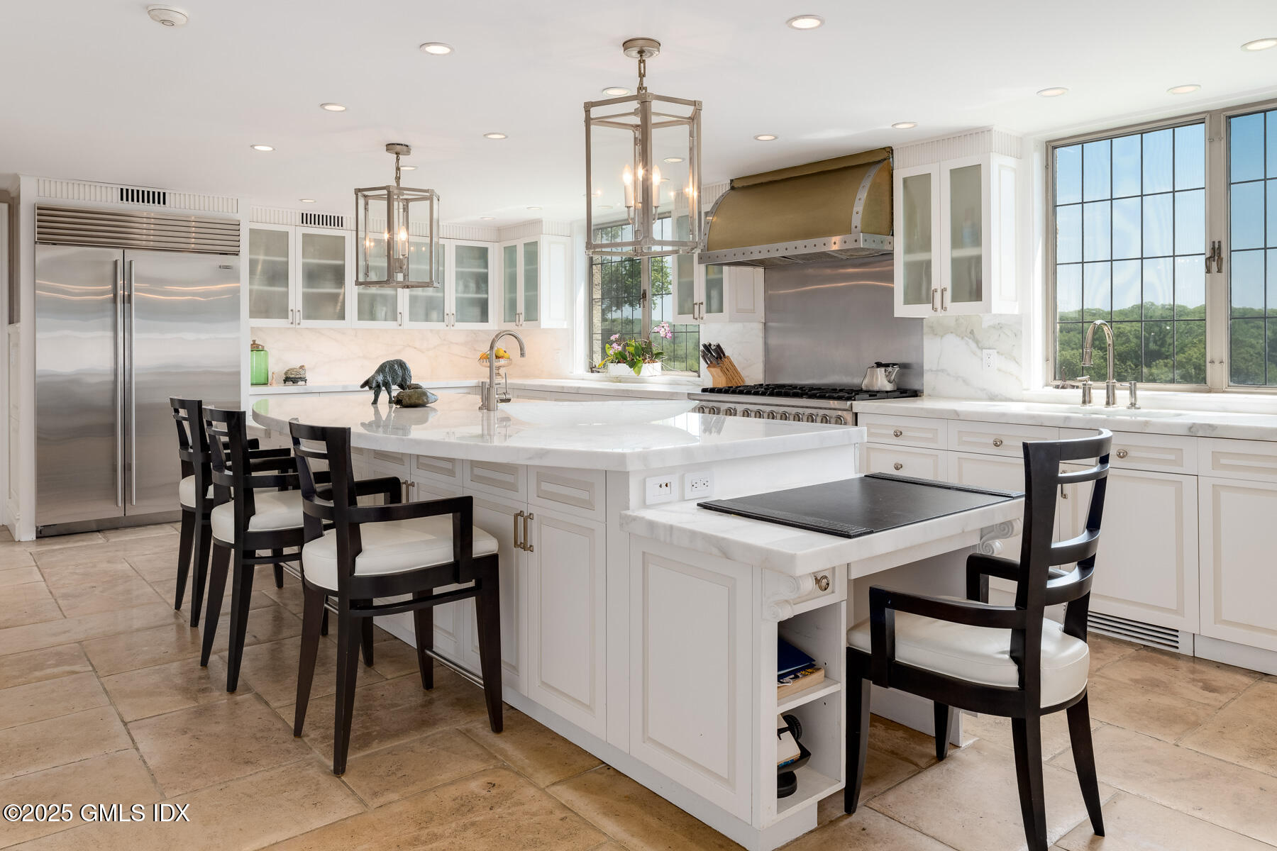 1233 Rock Rimmon Road Stamford, CT 06903 - Photo 10 of 50 a kitchen with a table chairs refrigerator and cabinets