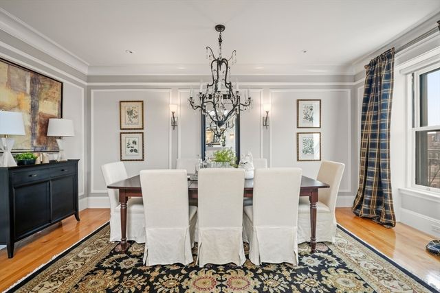 a view of a dining room with furniture and window
