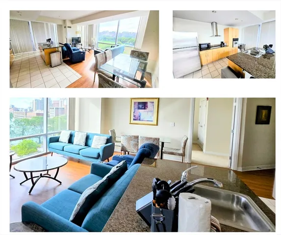 a living room with furniture kitchen view and a large window