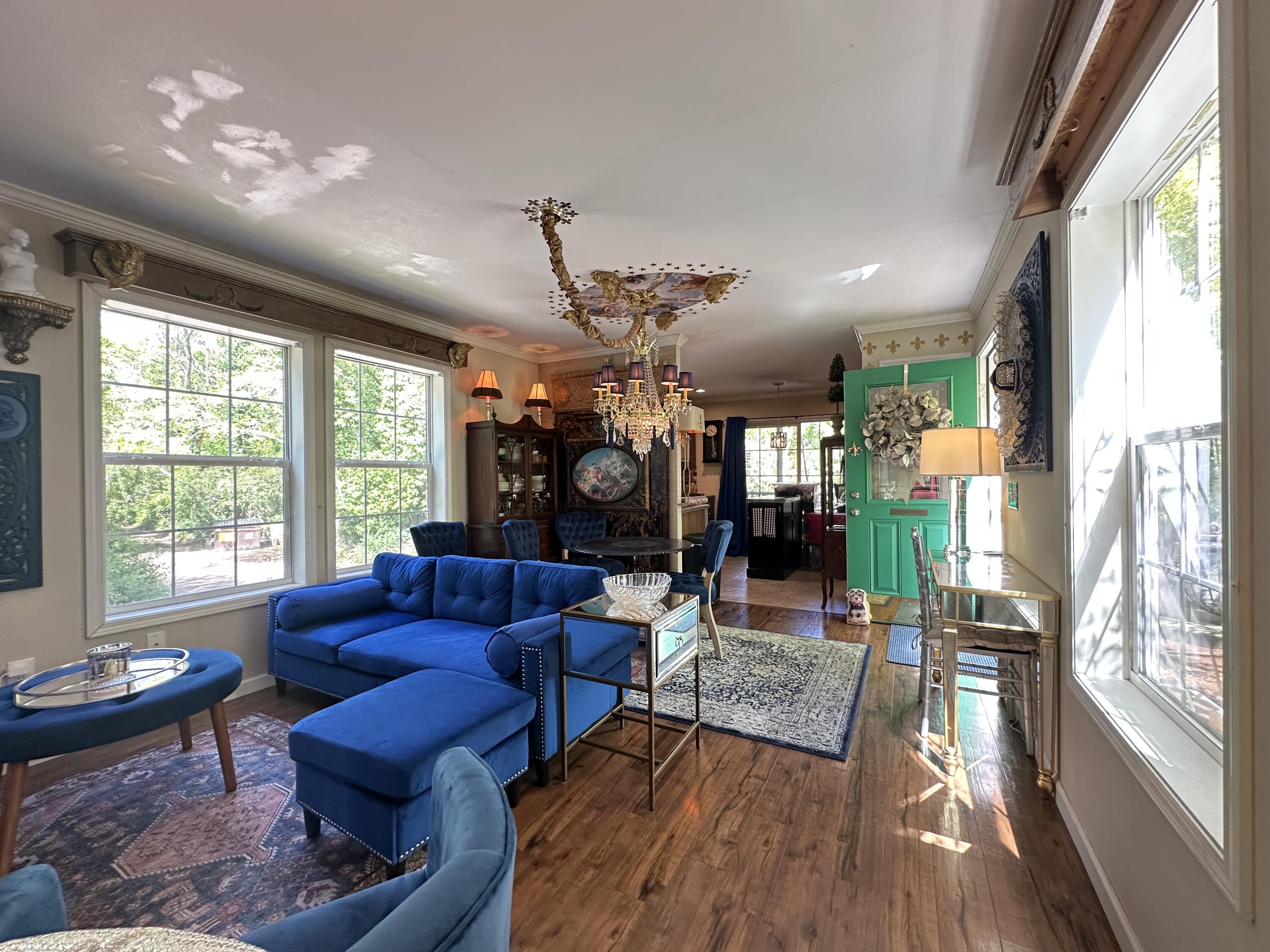 210 West Road, Unit E12 Wellfleet, MA 02667 - Photo 11 of 30 a living room with furniture and a large window