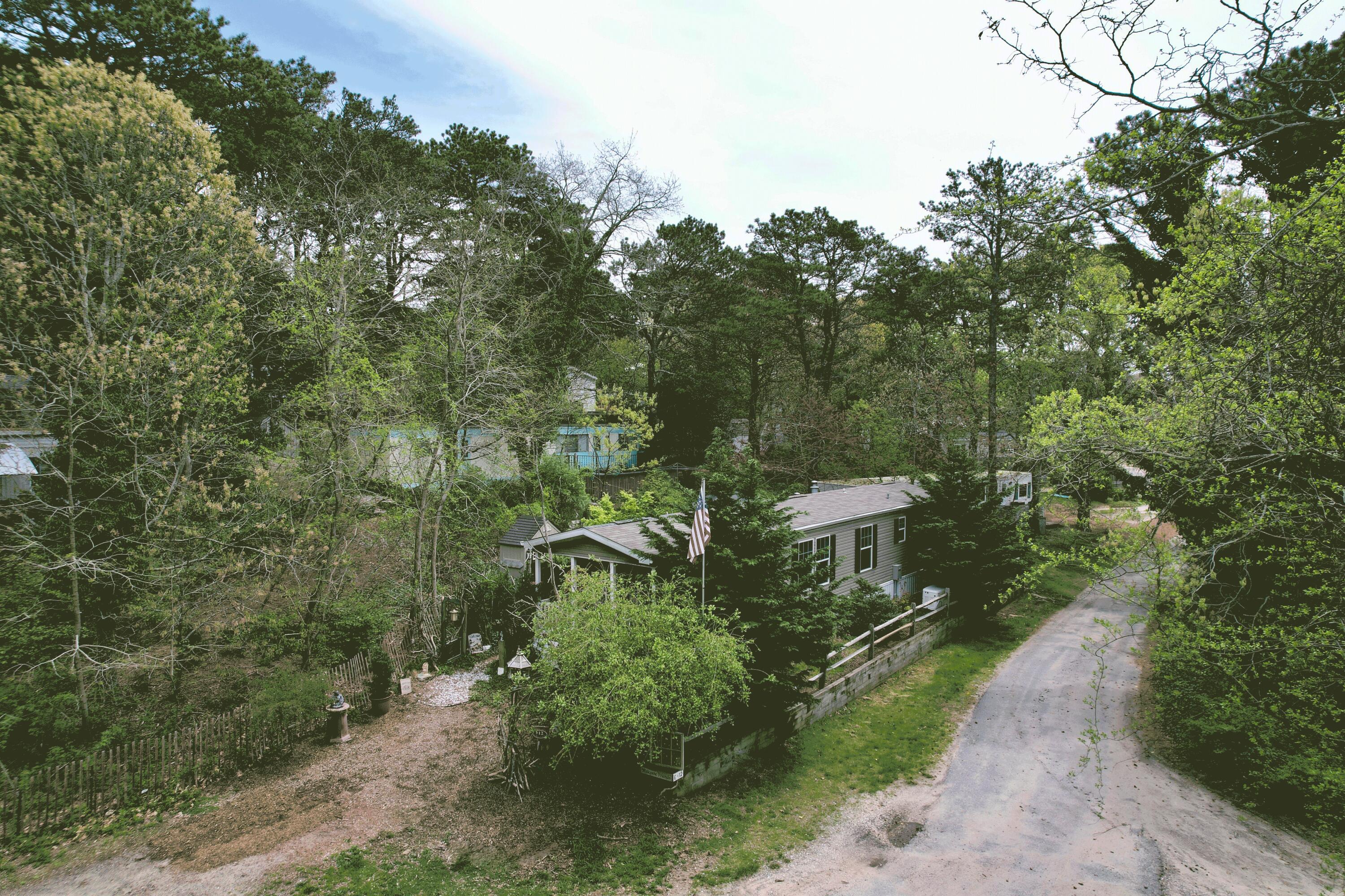 210 West Road, Unit E12 Wellfleet, MA 02667 - Photo 28 of 30 a view of a garden with trees
