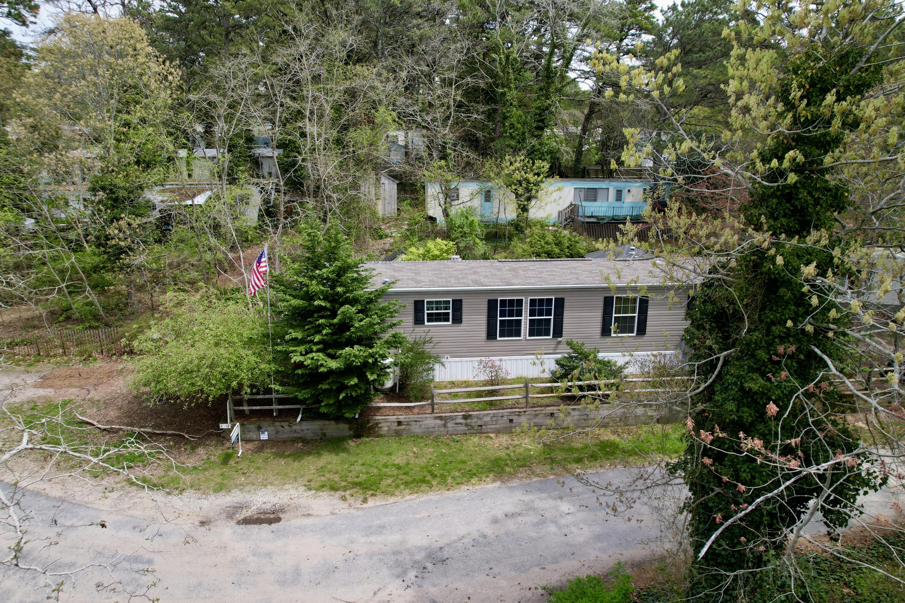 210 West Road, Unit E12 Wellfleet, MA 02667 - Photo 30 of 30 a front view of a house with garden