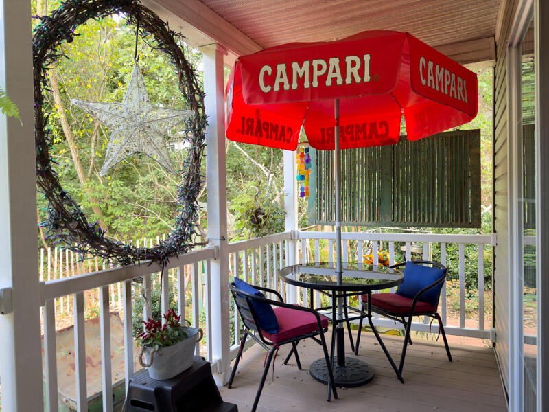 210 West Road, Unit E12 Wellfleet, MA 02667 - Photo 6 of 30 a view of an chairs and table in the balcony