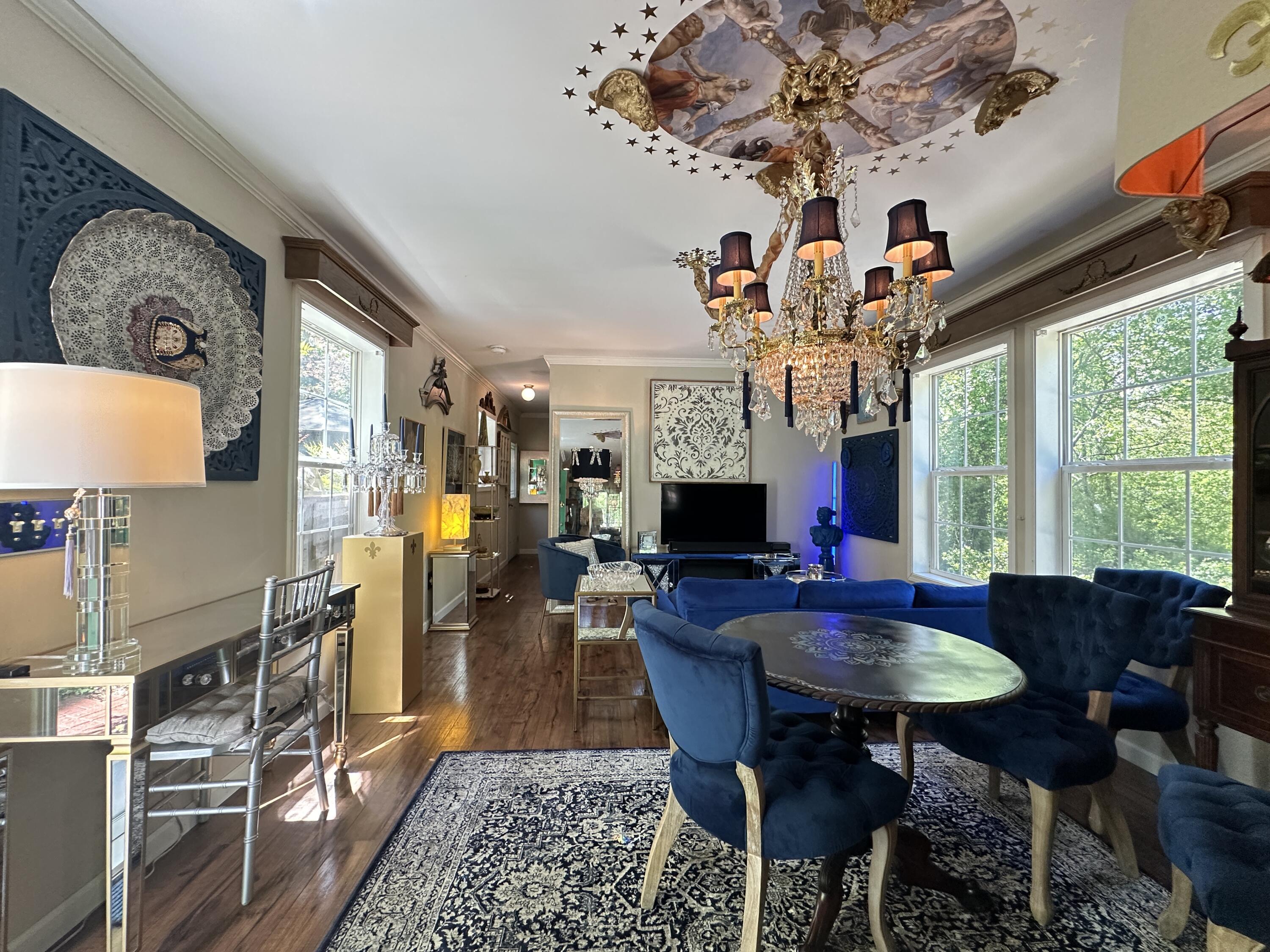 210 West Road, Unit E12 Wellfleet, MA 02667 - Photo 10 of 30 a view of a dining room with furniture window and wooden floor