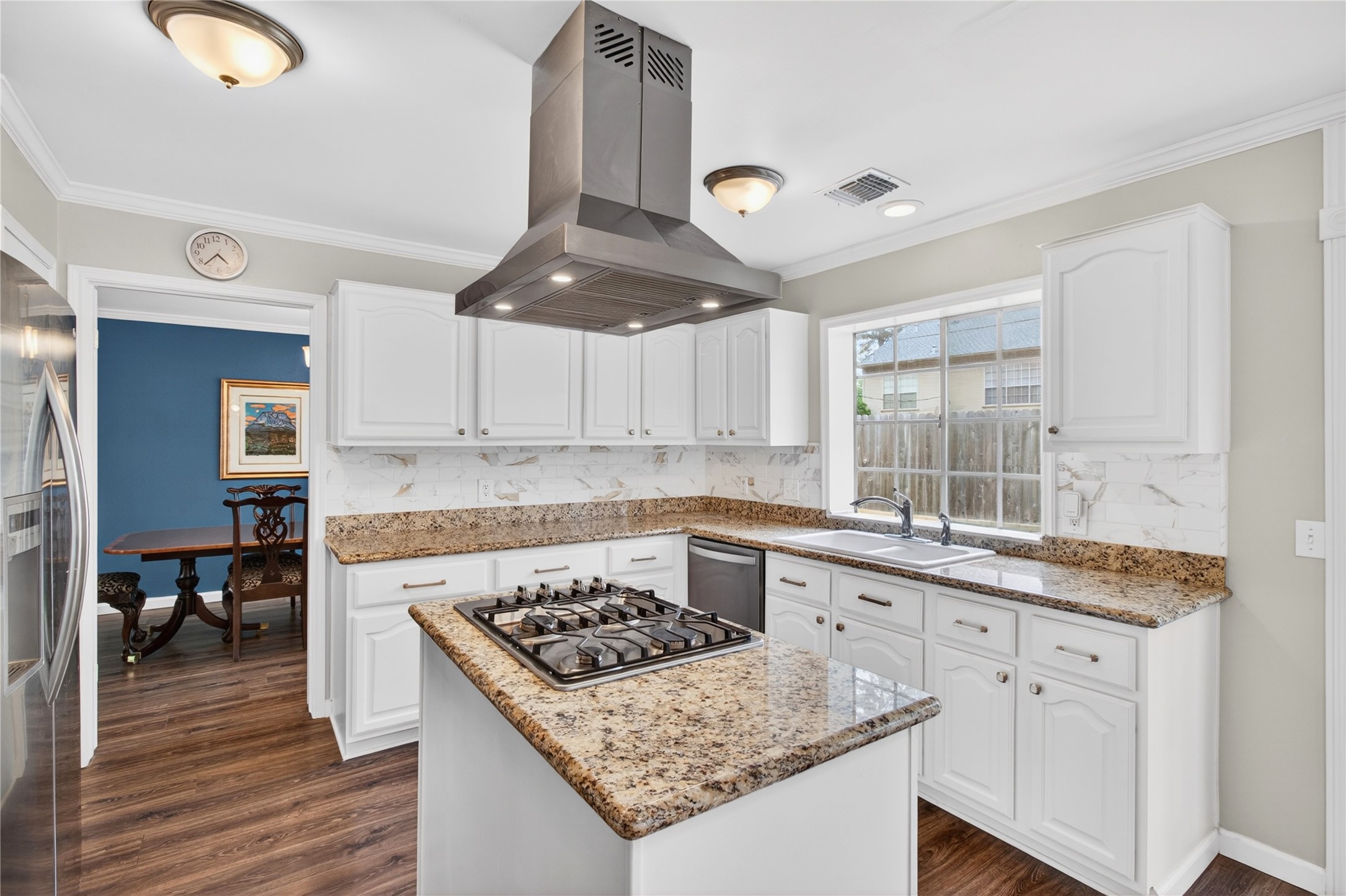 20214 Woodsboro Court Spring, TX 77388 - Photo 11 of 50 Recently Updated Kitchen! Painted cabinets, Stainless Appliances & Vent Hood, Tile Backsplash! Recently Painted Interior! Luxury Vinyl Plank throughout 1st Floor!