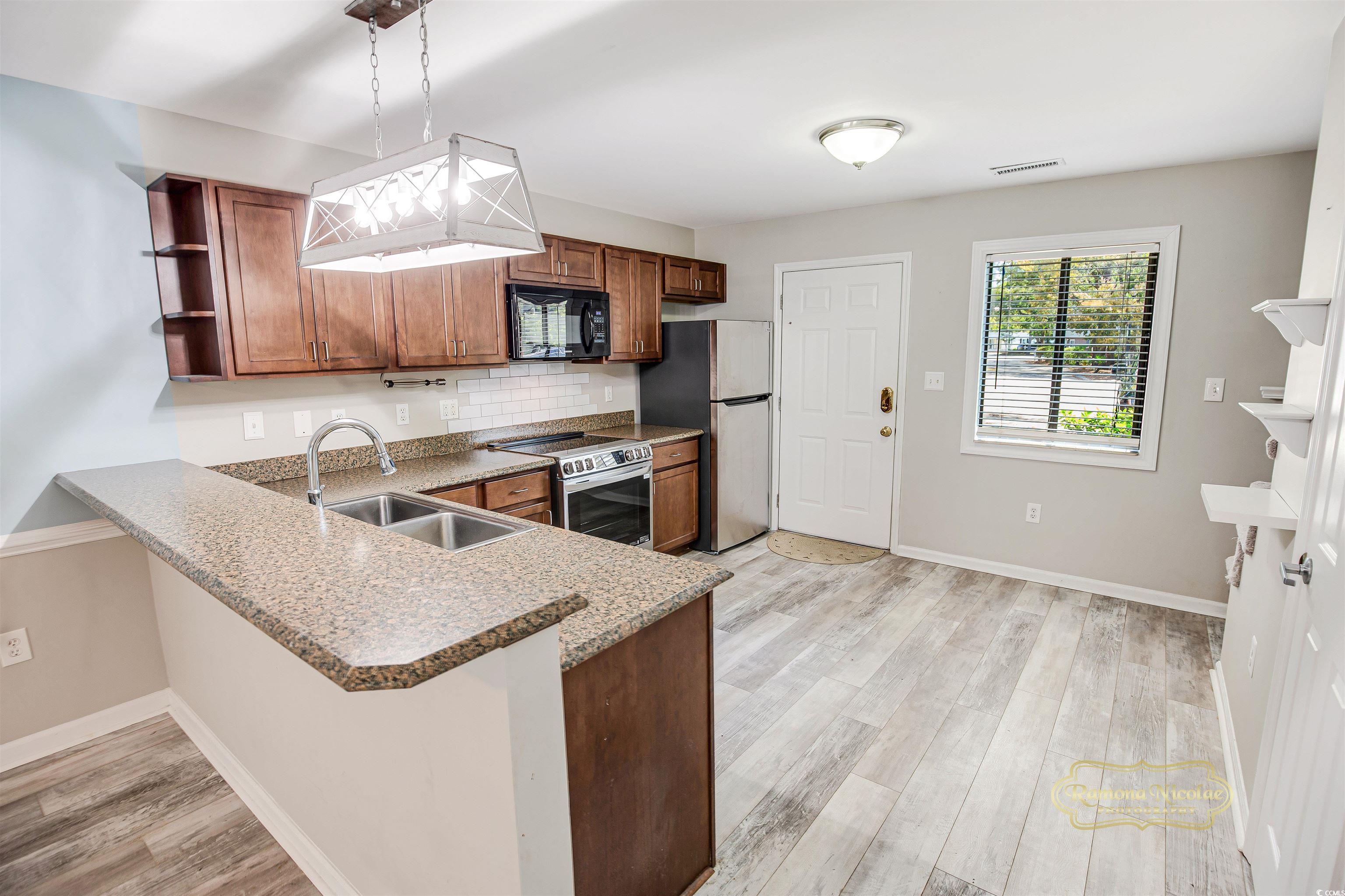 5161 Inlet Garden Court, Unit 8C Murrells Inlet, SC 29576 - Photo 6 of 31 Kitchen featuring light wood-type flooring, open s