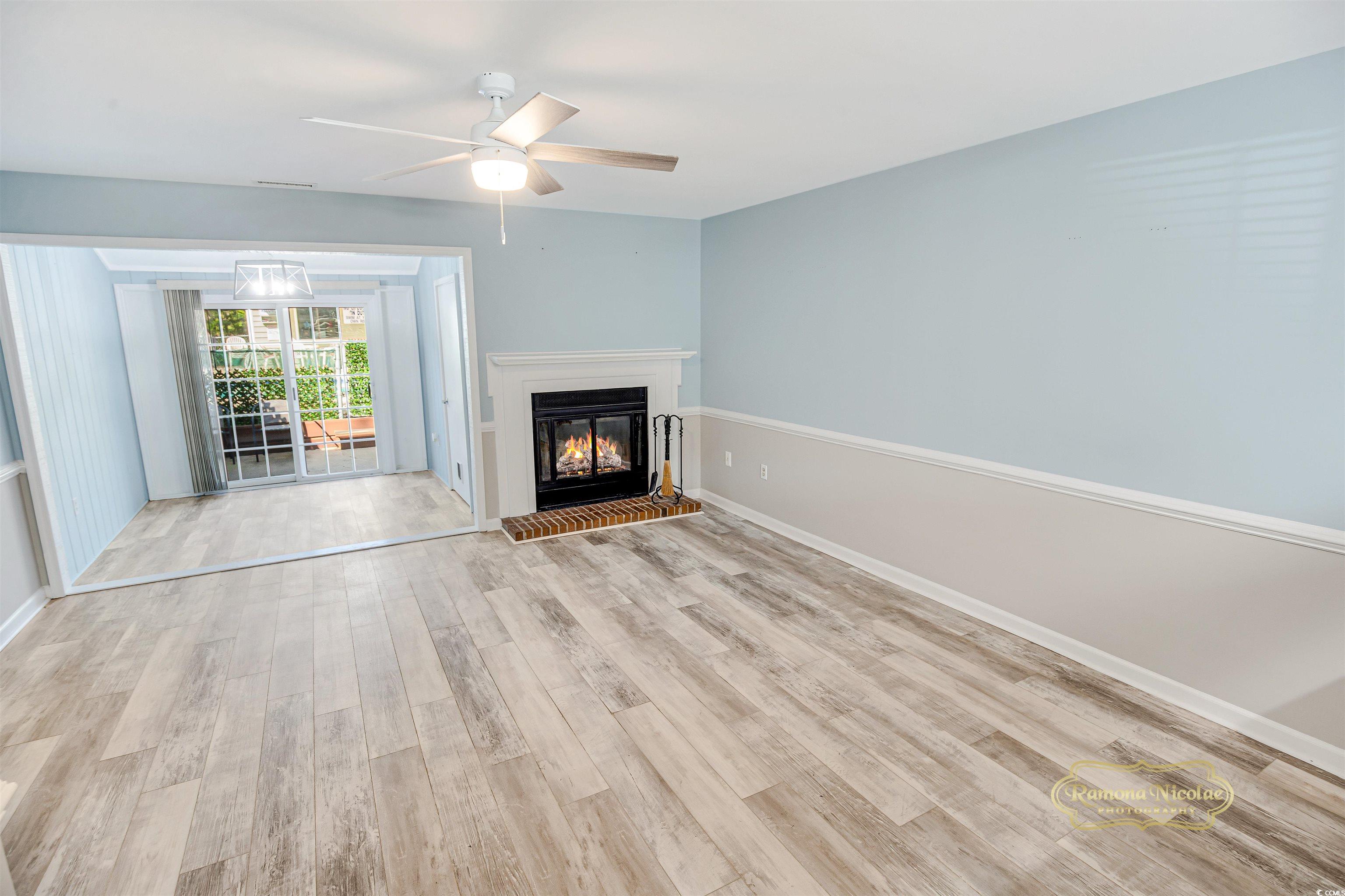 5161 Inlet Garden Court, Unit 8C Murrells Inlet, SC 29576 - Photo 7 of 31 Unfurnished living room featuring light wood finis